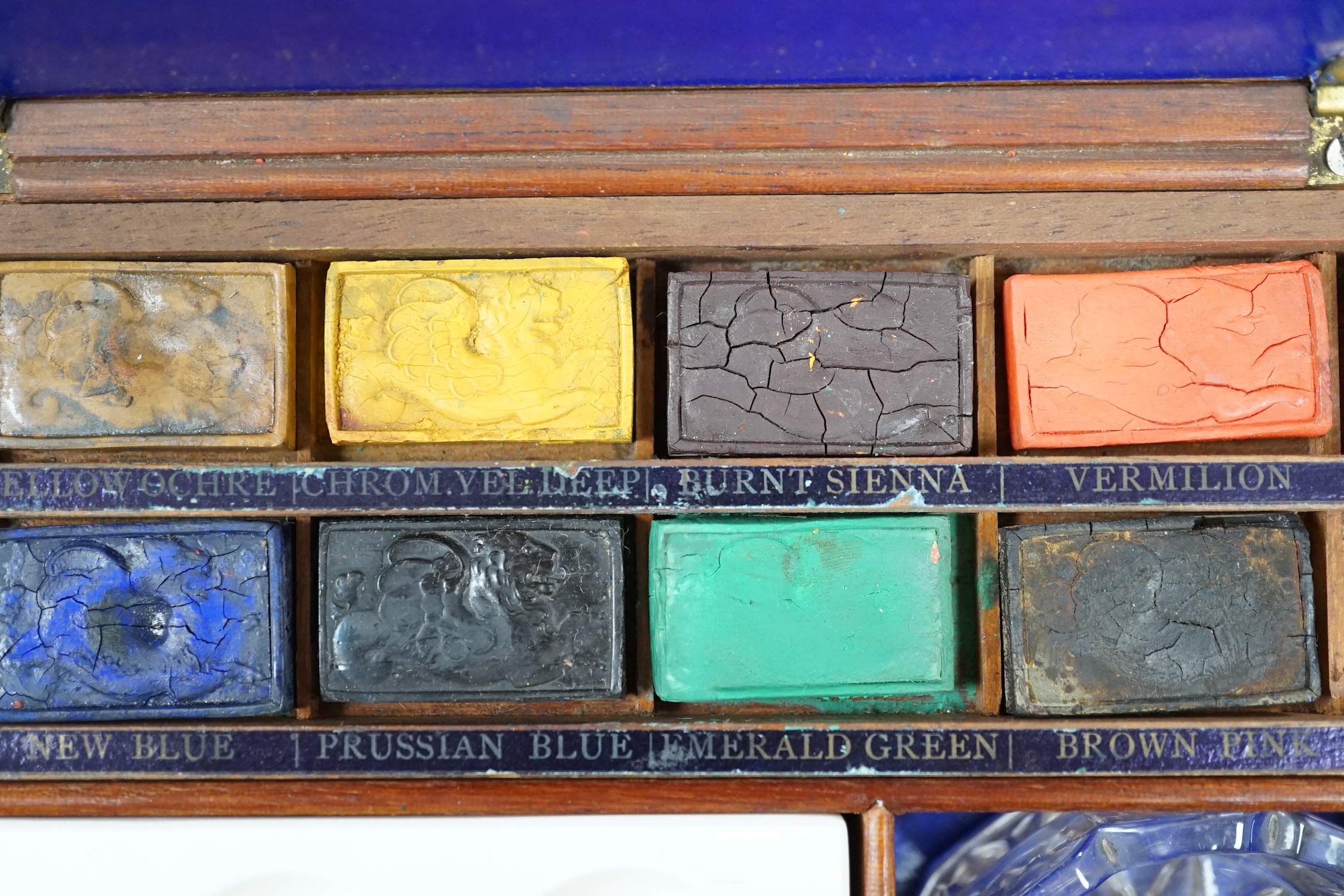 A Victorian Winsor and Newton artist's box with watercolour blocks, palettes etc. with key. Condition - fair
